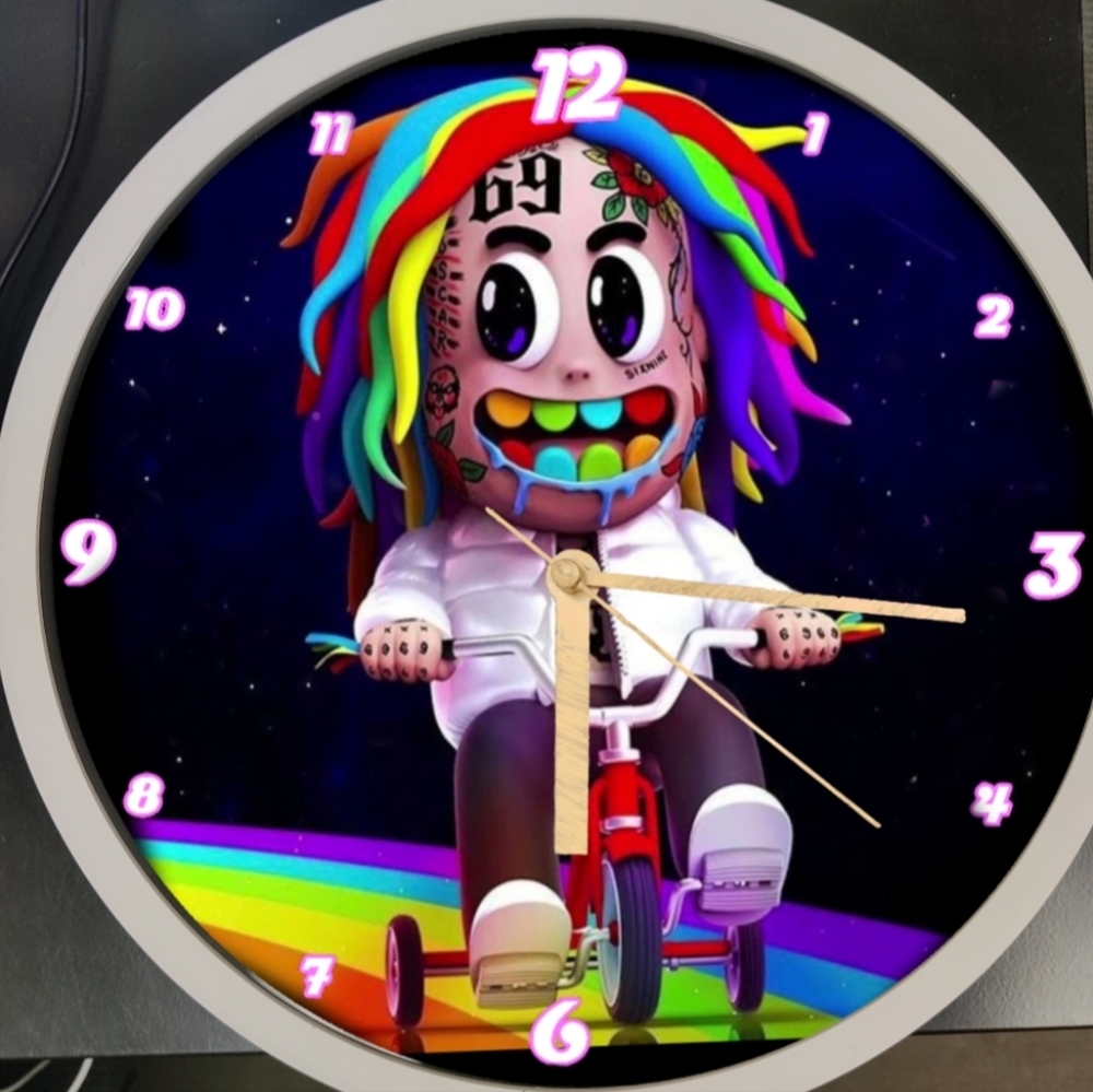 Tekashi on a rainbow bike
